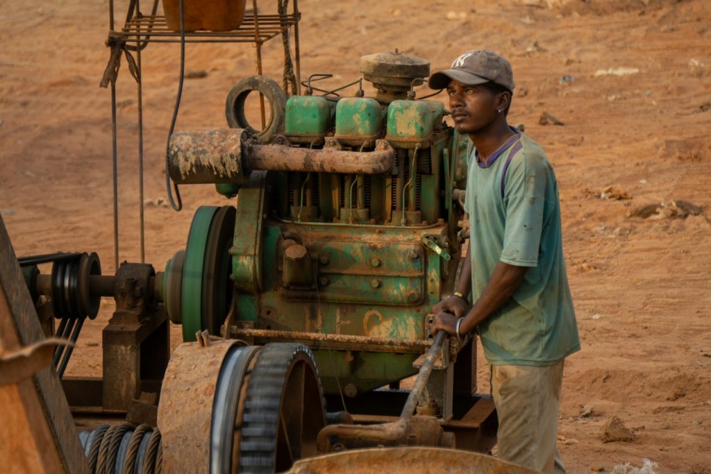 Machine operator with heavy equipment at a mine site
