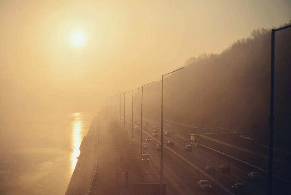 Cars on a motorway in misty morning light