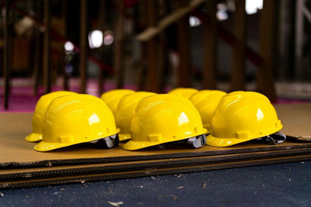 Yellow safety helmets lined up in a row