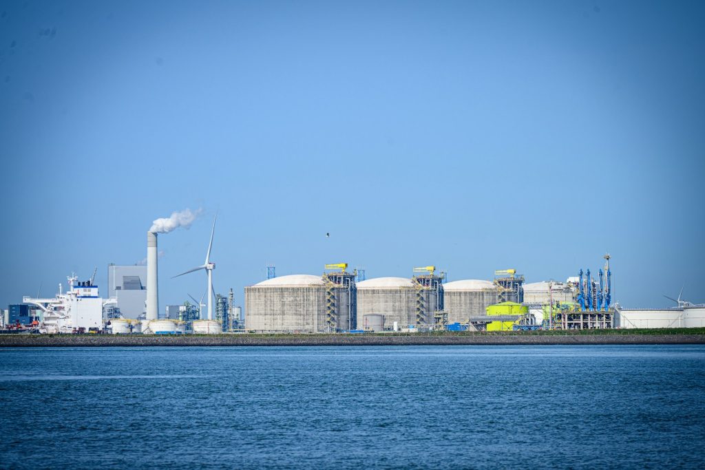 Industrial complex with storage tanks by the water