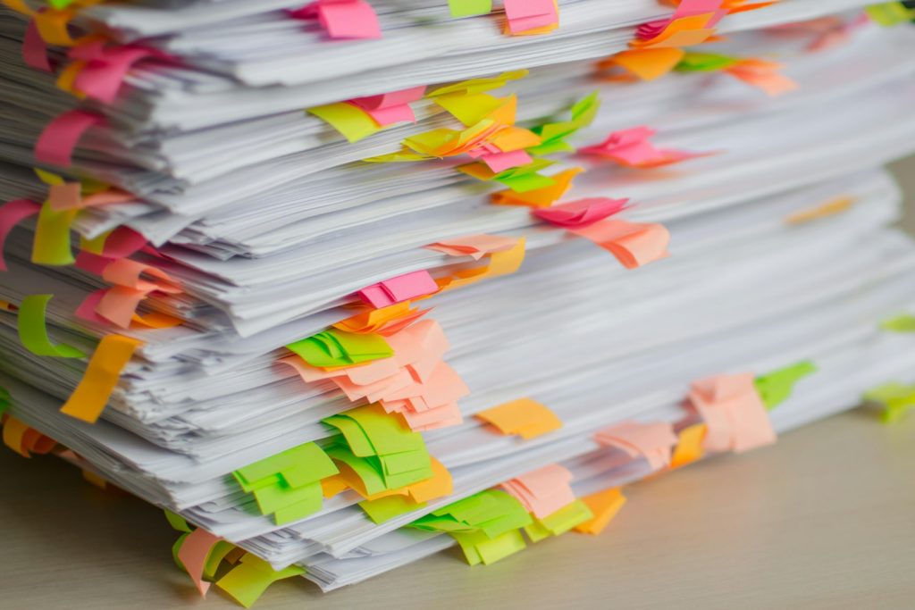 Stack of documents with colored tab markers
