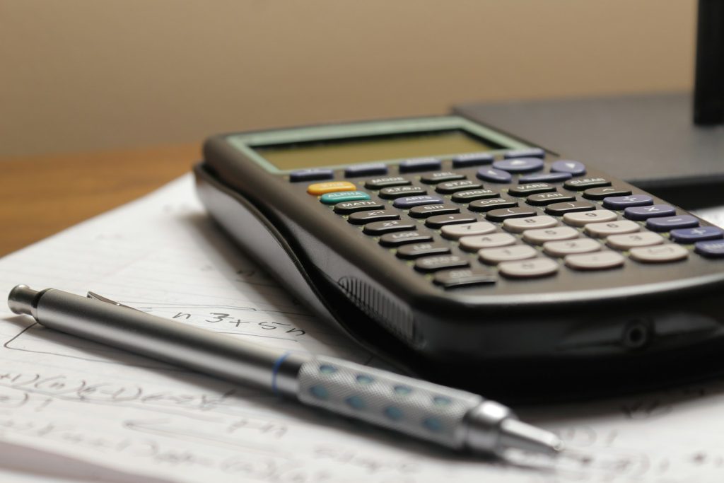 Calculator on a stack of insurance documents