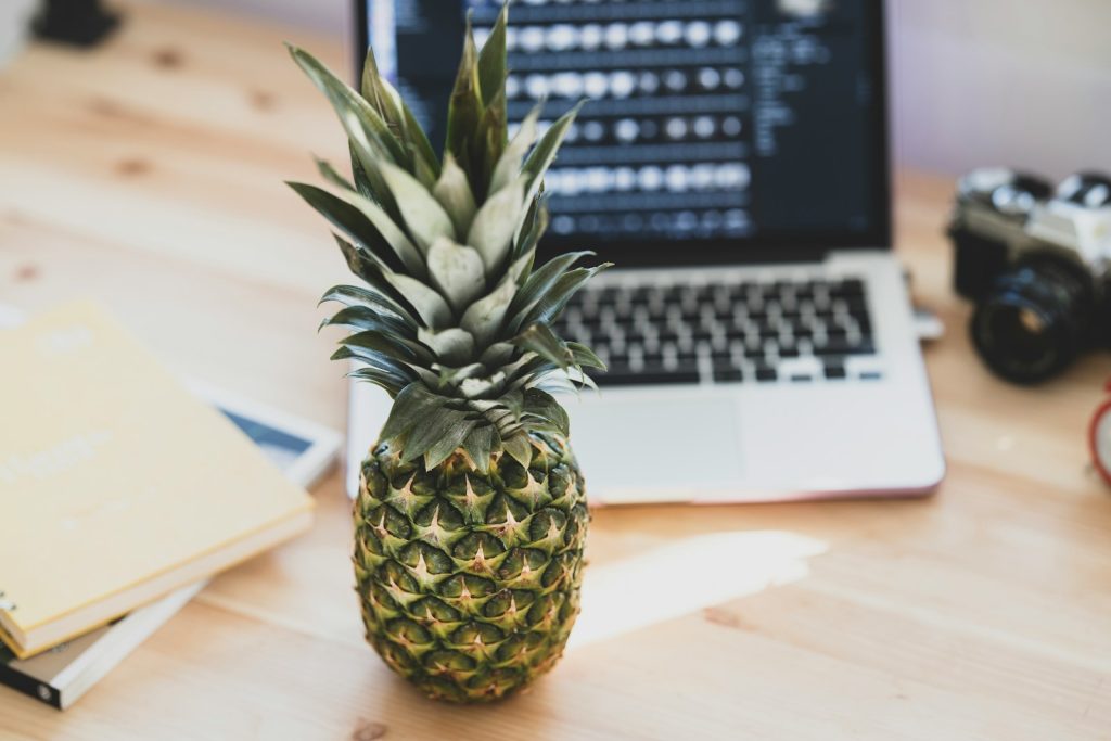 Fresh pineapple on a desk in an office