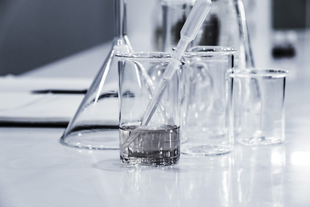 Chemical laboratory glassware with beakers on a workbench