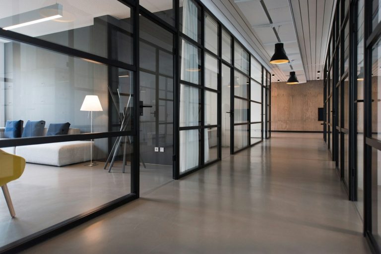 Empty office corridor with closed doors