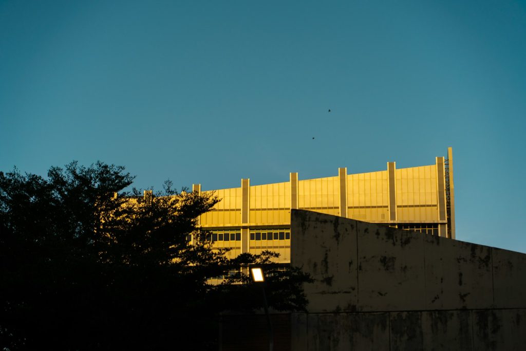 Facade of a modern government building against a blue sky