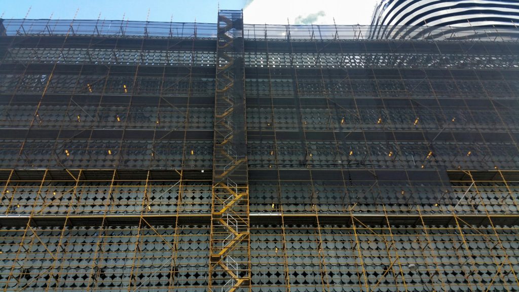 Scaffolding with safety netting along a building under construction