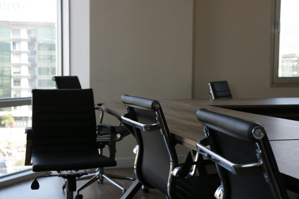 Empty office chairs at a desk in an abandoned office